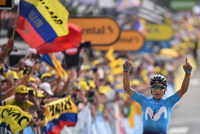 (FILES) Colombia's Nairo Quintana celebrates as he wins on the finish line of the eighteenth stage of the 106th edition of the Tour de France cycling race between Embrun and Valloire, in Valloire, on July 25, 2019. Quintana, the son of a farming family in the Andes, turned into a daring beetle who shook Colombia to its core, fighting epic battles that made him a legend. (Photo by Marco Bertorello / AFP)
