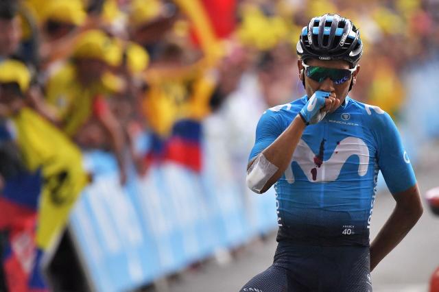 (FILES) Colombia's Nairo Quintana celebrates as he wins on the finish line of the eighteenth stage of the 106th edition of the Tour de France cycling race between Embrun and Valloire, in Valloire, on July 25, 2019. Quintana, the son of a farming family in the Andes, turned into a daring beetle who shook Colombia to its core, fighting epic battles that made him a legend. (Photo by Marco Bertorello / AFP)