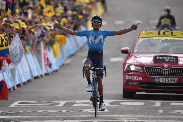 (FILES) Colombia's Nairo Quintana celebrates as he wins on the finish line of the eighteenth stage of the 106th edition of the Tour de France cycling race between Embrun and Valloire, in Valloire, on July 25, 2019. Quintana, the son of a farming family in the Andes, turned into a daring beetle who shook Colombia to its core, fighting epic battles that made him a legend. (Photo by Marco Bertorello / AFP)