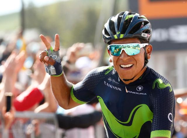 (FILES) Colombia's Nairo Quintana of team Movistar celebrates as he crosses the finish line to win the 9th stage of the 100th Giro d'Italia, Tour of Italy, cycling race from Montenero di Bisaccia to Blockhaus on May 14, 2017. Quintana, the son of a farming family in the Andes, turned into a daring beetle who shook Colombia to its core, fighting epic battles that made him a legend. (Photo by Luk BENIES / AFP)