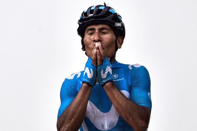 (FILES) Colombia's Nairo Quintana celebrates as he crosses the finish line to win the 17th stage of the 105th edition of the Tour de France cycling race, between Bagneres-de-Luchon and Saint-Lary-Soulan Col du Portet, southwestern France, on July 25, 2018. Quintana, the son of a farming family in the Andes, turned into a daring beetle who shook Colombia to its core, fighting epic battles that made him a legend. (Photo by Jeff PACHOUD / AFP)