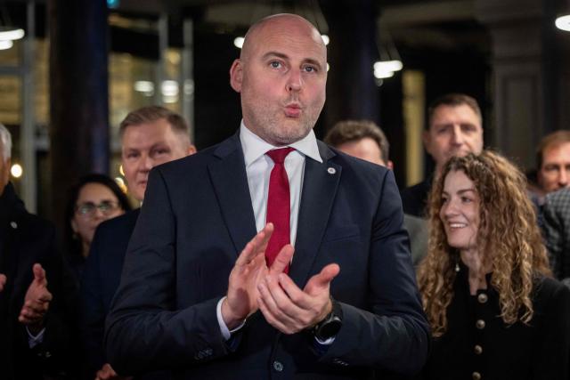 Latvia's Prime Minister Andris Kulbergs reacts after first exit poll results of the general election was announced during his Apvienotais Saraksts (United List) party’s election night in Riga on October 3, 2026. (Photo by Wojtek RADWANSKI / AFP)