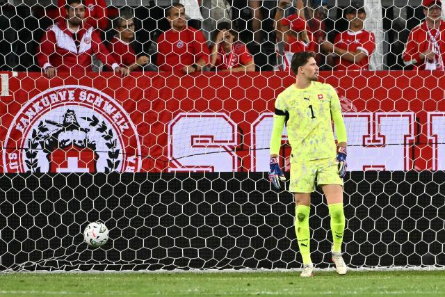 Switzerland's goalkeeper #01 Gregor Kobel reacts after Slovenia's Slovenian forward #18 Zan Vipotnik (not in picture) scored his team's first goal during the UEFA Nations League Group B1 football match between Switzerland and Slovenia at the Thermoplan Arena in Lucerne on October 3, 2026. (Photo by Fabrice COFFRINI / AFP)