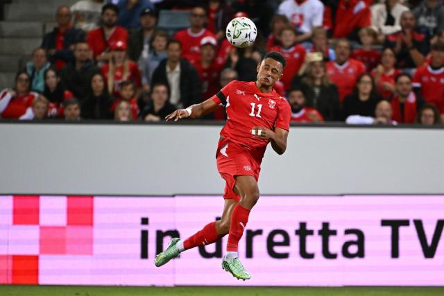Switzerland's forward Dan Ndoye heads the ball during the UEFA Nations League Group B1 football match between Switzerland and Slovenia at the Thermoplan Arena in Lucerne on October 3, 2026. (Photo by Fabrice COFFRINI / AFP)
