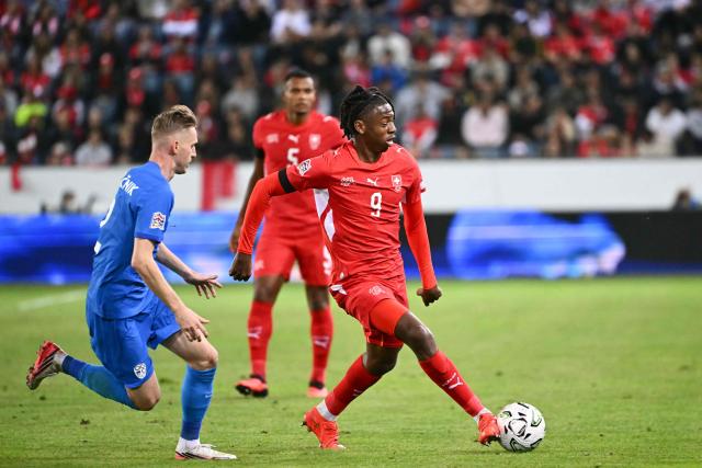 Slovenia's defender #02 Zan Karnicnik (L) and Switzerland's midfielder #09 Johan Manzambi fight for the ball during the UEFA Nations League Group B1 football match between Switzerland and Slovenia at the Thermoplan Arena in Lucerne on October 3, 2026. (Photo by Fabrice COFFRINI / AFP)