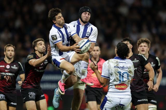 Castres' Uruguayan scrum-half Santiago Arata (top-L) grabs the ball during the French Top14 rugby union match between Castres Olympique and Stade Toulousain at Stade Pierre Fabre in Castres, southwestern France, on October 3, 2026. (Photo by Valentine CHAPUIS / AFP)
