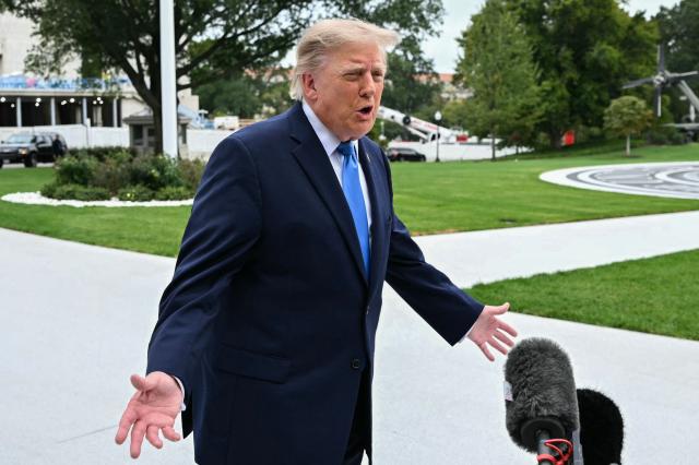 US President Donald Trump talks to the media before boarding Marine One on the South Lawn of the White House, in Washington, DC, on October 3, 2026. President Trump is travelling to Ohio for a midterm campaign rally. (Photo by Alex WROBLEWSKI / AFP)