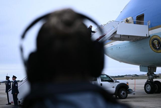 US President Donald Trump boards Air Force One at Joint Base Andrews, Maryland, on October 3, 2026. President Trump is travelling to Ohio for a midterm campaign rally. (Photo by Brendan SMIALOWSKI / AFP)