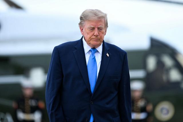 US President Donald Trump walks to board Air Force One at Joint Base Andrews, Maryland, on October 3, 2026. President Trump is travelling to Ohio for a midterm campaign rally. (Photo by Brendan SMIALOWSKI / AFP)