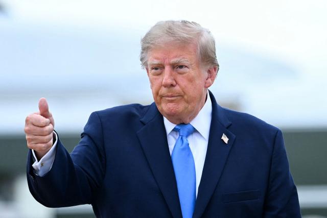 US President Donald Trump walks to board Air Force One at Joint Base Andrews, Maryland, on October 3, 2026. President Trump is travelling to Ohio for a midterm campaign rally. (Photo by Brendan SMIALOWSKI / AFP)