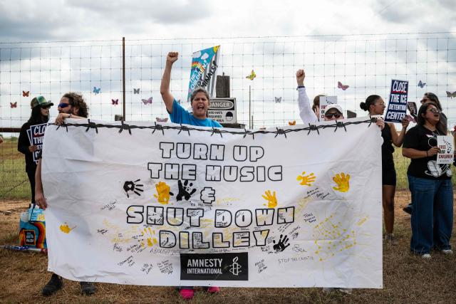 Demonstrators protest in support of families detained inside the Dilley Detention Center in Dilley, Texas on October 3, 2026. (Photo by RONALDO SCHEMIDT / AFP)