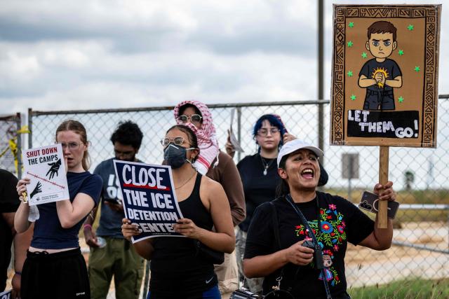 Demonstrators protest in support of families detained inside the Dilley Detention Center in Dilley, Texas on October 3, 2026. (Photo by RONALDO SCHEMIDT / AFP)
