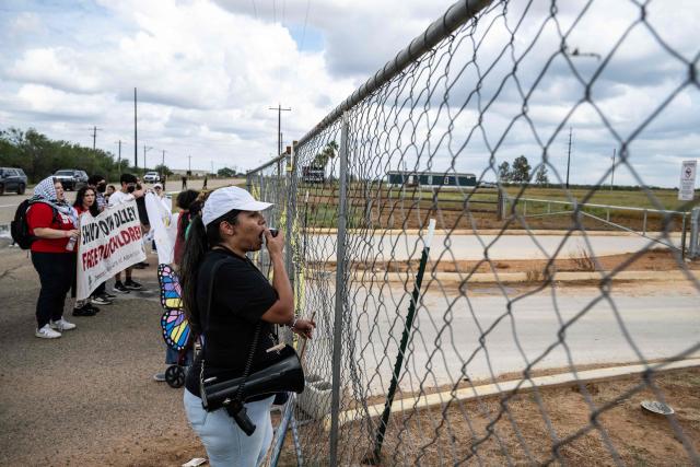 Demonstrators protest in support of families detained inside the Dilley Detention Center in Dilley, Texas on October 3, 2026. (Photo by RONALDO SCHEMIDT / AFP)