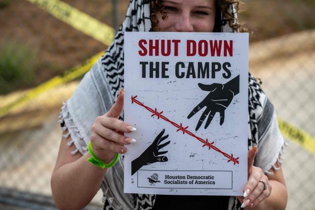 Demonstrators protest in support of families detained inside the Dilley Detention Center in Dilley, Texas on October 3, 2026. (Photo by RONALDO SCHEMIDT / AFP)