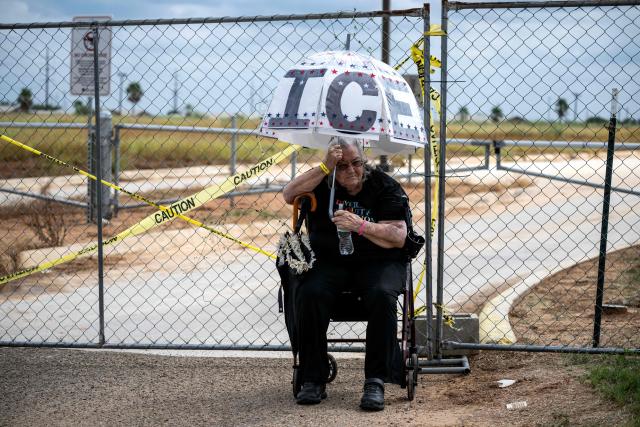 Demonstrators protest in support of families detained inside the Dilley Detention Center in Dilley, Texas on October 3, 2026. (Photo by RONALDO SCHEMIDT / AFP)