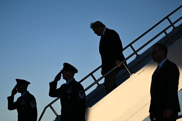 US President Donald Trump steps off Air Force One upon arrival to Dayton International Airport in Ohio, on October 3, 2026. Trump will speak at a campaign rally in support of Republican Senator Jon Husted. (Photo by Brendan SMIALOWSKI / AFP)