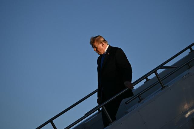 US President Donald Trump steps off Air Force One upon arrival to Dayton International Airport in Ohio, on October 3, 2026. Trump will speak at a campaign rally in support of Republican Senator Jon Husted. (Photo by Brendan SMIALOWSKI / AFP)