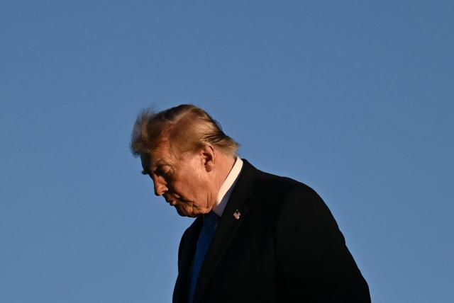 US President Donald Trump steps off Air Force One upon arrival to Dayton International Airport in Ohio, on October 3, 2026. Trump will speak at a campaign rally in support of Republican Senator Jon Husted. (Photo by Brendan SMIALOWSKI / AFP)