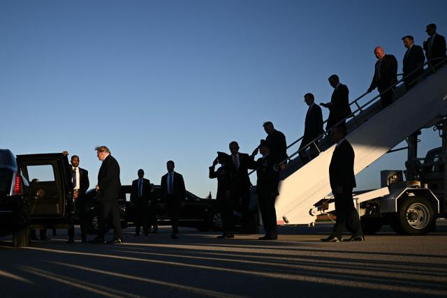 US President Donald Trump (L) steps off Air Force One upon arrival to Dayton International Airport in Ohio, on October 3, 2026. Trump will speak at a campaign rally in support of Republican Senator Jon Husted. (Photo by Brendan SMIALOWSKI / AFP)