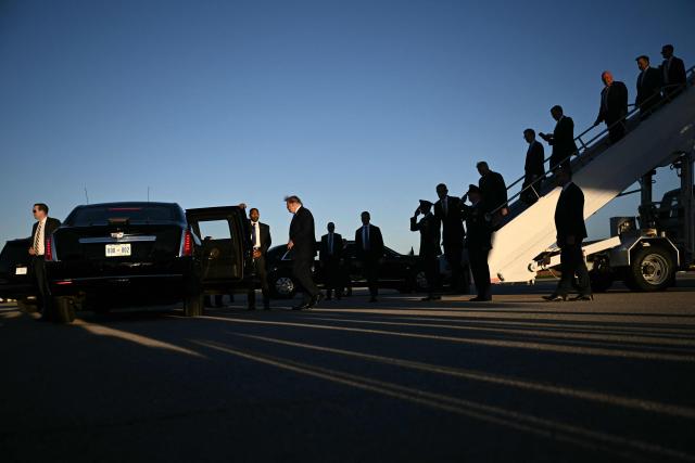 US President Donald Trump (C) steps off Air Force One upon arrival to Dayton International Airport in Ohio, on October 3, 2026. Trump will speak at a campaign rally in support of Republican Senator Jon Husted. (Photo by Brendan SMIALOWSKI / AFP)