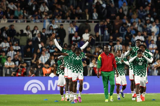 Burkina Faso's players warm up ahead of the international friendly football match between Argentina and Burkina Faso at the Mas Monumental stadium in Buenos Aires on October 3, 2026. (Photo by Alejandro PAGNI / AFP)