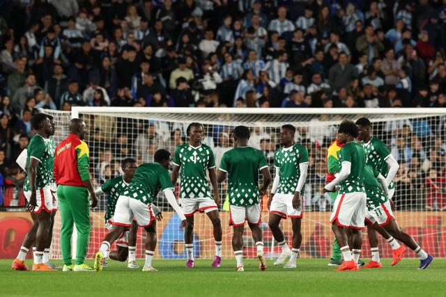 Burkina Faso's players warm up ahead of the international friendly football match between Argentina and Burkina Faso at the Mas Monumental stadium in Buenos Aires on October 3, 2026. (Photo by Alejandro PAGNI / AFP)