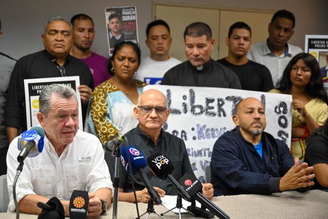 former political prisoner Jose Ignacio Moreno (L) and Jose Sanchez (Mazuco) (R) attend a press conference in Maracaibo, Venezuela on October 3, 2026. After Nicolas Maduro's capture in a US operation in January, interim President Delcy Rodriguez, who governs under pressure from Washington, pushed through an amnesty that she says has led to the release of 1,046 people from prison. (Photo by Maryorin Mendez / AFP)