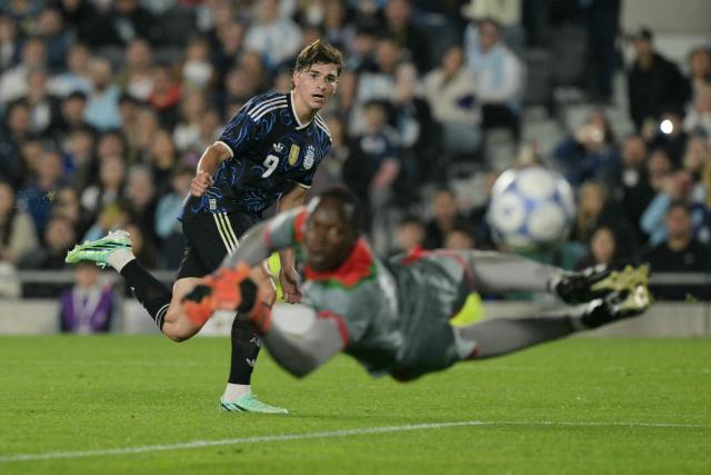 Argentina's forward #09 Julian Alvarez reacts past Burkina Faso's goalkeeper #01 Razak Guira during the international friendly football match between Argentina and Burkina Faso at the Mas Monumental stadium in Buenos Aires on October 3, 2026. (Photo by JUAN MABROMATA / AFP)