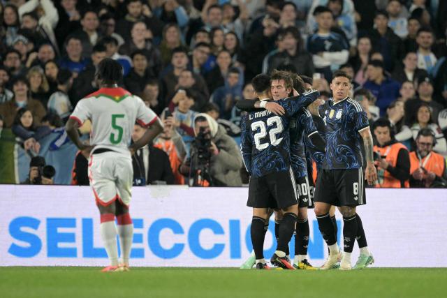 Argentina's forward #30 Franco Mastantuono (C) celebrates scoring his team's sixth goal with teammates during the international friendly football match between Argentina and Burkina Faso at the Mas Monumental stadium in Buenos Aires on October 3, 2026. (Photo by JUAN MABROMATA / AFP)