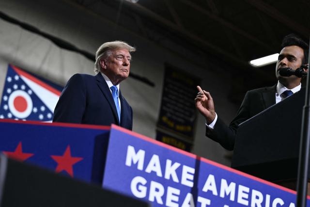 US President Donald Trump looks on as Ohio Governor candidate Vivek Ramaswamy speaks during a campaign rally in Vandalia, Ohio, on October 3, 2026. (Photo by Brendan SMIALOWSKI / AFP)