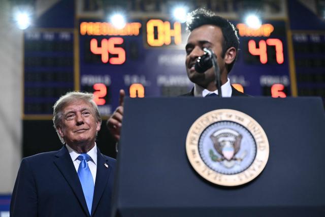 US President Donald Trump looks on as Ohio Governor candidate Vivek Ramaswamy speaks during a campaign rally in Vandalia, Ohio, on October 3, 2026. (Photo by Brendan SMIALOWSKI / AFP)