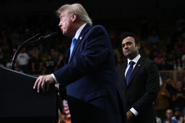 Ohio Governor candidate Vivek Ramaswamy looks on as US President Donald Trump speaks during a campaign rally in Vandalia, Ohio, on October 3, 2026. (Photo by Brendan SMIALOWSKI / AFP)