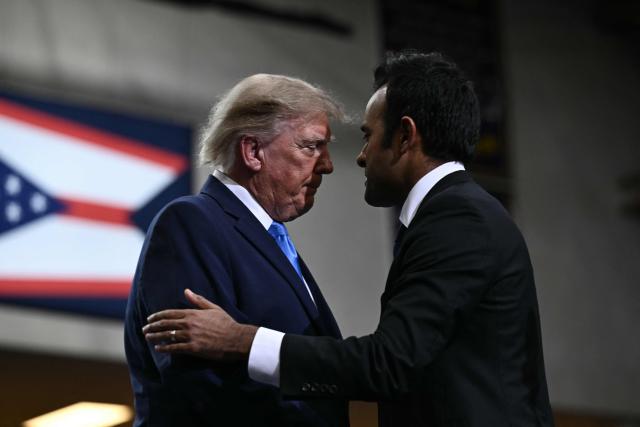 US President Donald Trump speaks with Ohio Governor candidate Vivek Ramaswamy after speaking during a campaign rally in Vandalia, Ohio, on October 3, 2026. (Photo by Brendan SMIALOWSKI / AFP)