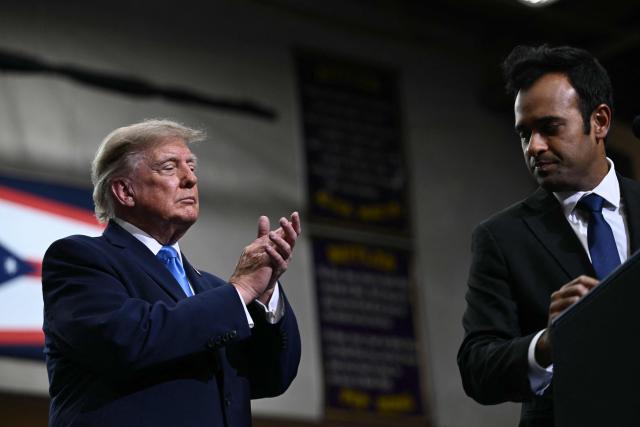 US President Donald Trump applauds Ohio Governor candidate Vivek Ramaswamy after speaking during a campaign rally in Vandalia, Ohio, on October 3, 2026. (Photo by Brendan SMIALOWSKI / AFP)
