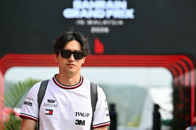 Cadillac's Chinese reserve driver Zhou Guanyu arrives ahead of the Formula One Bahrain Grand Prix in Sepang on October 4, 2026. (Photo by Lillian SUWANRUMPHA / AFP)