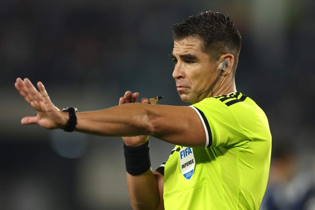 Chilean referee Jose Cabrero gestures during the international friendly football match between Argentina and Burkina Faso at the Mas Monumental stadium in Buenos Aires on October 3, 2026. (Photo by Alejandro PAGNI / AFP)