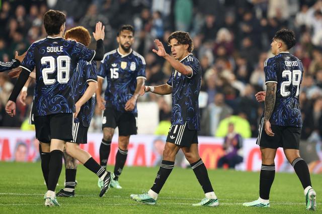 Argentina's midfielder #17 Giuliano Simeone celebrates scoring his team's seventh goal with teammates during the international friendly football match between Argentina and Burkina Faso at the Mas Monumental stadium in Buenos Aires on October 3, 2026. (Photo by Alejandro PAGNI / AFP)