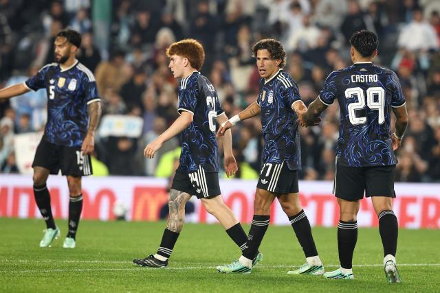 Argentina's midfielder #17 Giuliano Simeone celebrates scoring his team's seventh goal with teammates during the international friendly football match between Argentina and Burkina Faso at the Mas Monumental stadium in Buenos Aires on October 3, 2026. (Photo by Alejandro PAGNI / AFP)