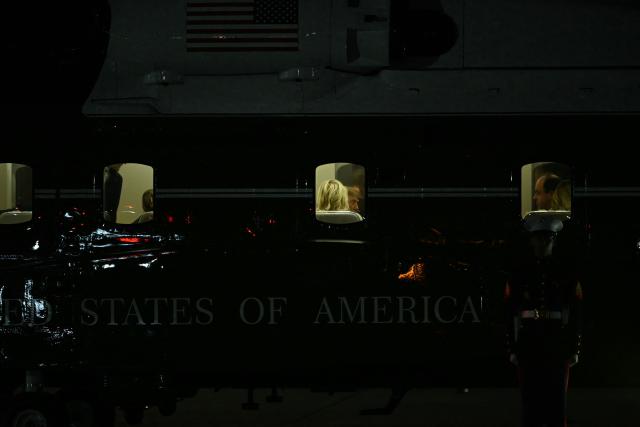 US President Donald Trump is seen aboard Marine One before departing Joint Base Andrews, Maryland, on October 3, 2026. President Trump is returning to Washington after a trip to Ohio where he spoke at a midterm campaign rally. (Photo by Brendan SMIALOWSKI / AFP)