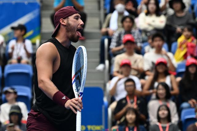 France's Kyrian Jacquet reacts as he plays against Spain's Jaume Munar during their men's singles quarter-final tennis match at the ATP Tour Japan Open Tennis Championships at the Ariake Tennis Forest Park in Tokyo on October 4, 2026. (Photo by Rie KIKUCHI / AFP)