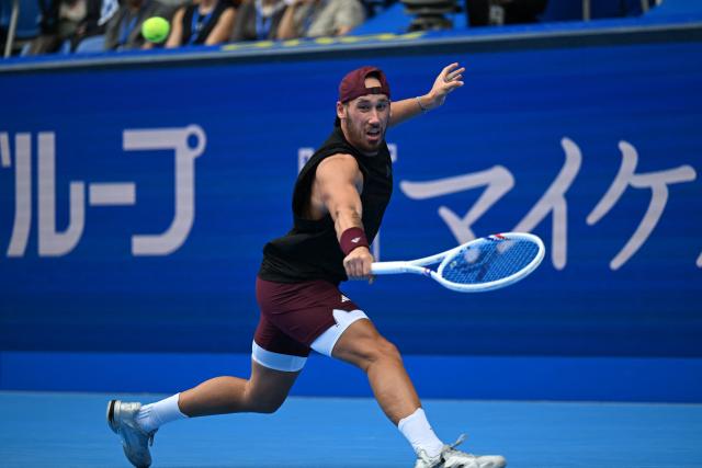 France's Kyrian Jacquet hits a return against Spain's Jaume Munar during their men's singles quarter-final tennis match at the ATP Tour Japan Open Tennis Championships at the Ariake Tennis Forest Park in Tokyo on October 4, 2026. (Photo by Rie KIKUCHI / AFP)