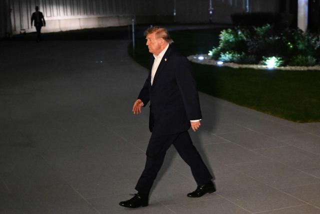 US President Donald Trump walks to the White House after disembarking from Marine One on the South Lawn in Washington, DC, on October 3, 2026. President Trump is returning from Ohio where he spoke at a midterm campaign rally. (Photo by Alex WROBLEWSKI / AFP)
