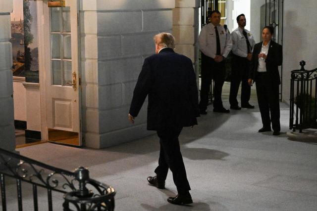 US President Donald Trump walks to the White House after disembarking from Marine One on the South Lawn in Washington, DC, on October 3, 2026. President Trump is returning from Ohio where he spoke at a midterm campaign rally. (Photo by Alex WROBLEWSKI / AFP)