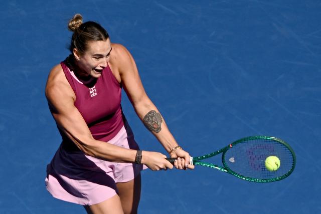 Belarus's Aryna Sabalenka hits a return to Czech Republic's Nikola Bartunkova during their women's singles match at the China Open tennis tournament in Beijing on October 4, 2026. (Photo by Pedro PARDO / AFP)