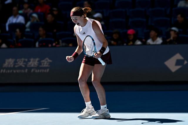 Czech Republic's Nikola Bartunkova celebrates her victory over Belarus's Aryna Sabalenka during their women's singles match at the China Open tennis tournament in Beijing on October 4, 2026. (Photo by Pedro PARDO / AFP)