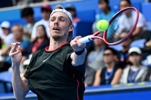 Canada's Denis Shapovalov hits a return against Spain's Carlos Alcaraz during their men's singles quarter-final tennis match at the ATP Tour Japan Open Tennis Championships at the Ariake Tennis Forest Park in Tokyo on October 4, 2026. (Photo by Rie KIKUCHI / AFP)
