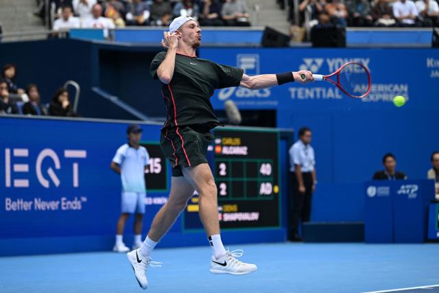 Canada's Denis Shapovalov hits a return against Spain's Carlos Alcaraz during their men's singles quarter-final tennis match at the ATP Tour Japan Open Tennis Championships at the Ariake Tennis Forest Park in Tokyo on October 4, 2026. (Photo by Rie KIKUCHI / AFP)