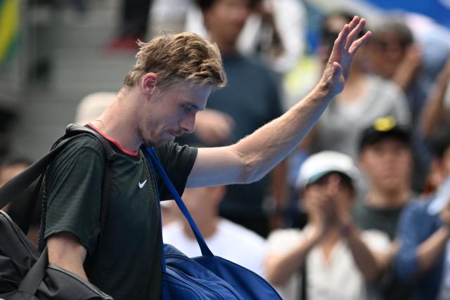 Canada's Denis Shapovalov waves to fans as he retires the men's singles quarter-final tennis match against Spain's Carlos Alcaraz due to an injury at the ATP Tour Japan Open Tennis Championships at the Ariake Tennis Forest Park in Tokyo on October 4, 2026. (Photo by Rie KIKUCHI / AFP)