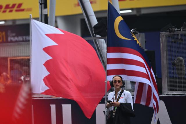 A general view of the Bahrain and Malaysia flags ahead of the Formula One Bahrain Grand Prix in Sepang on October 4, 2026. (Photo by JADE GAO / AFP)