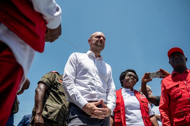 French Minister for Europe and Foreign Affairs Jean-Noël Barrot speaks with Red Cross healthcare workers during his visit to the Rwampara Ebola Treatment Centre in Bunia, Ituri Province, Democratic Republic of Congo, on October 3, 2026. (Photo by Hardy BOPE / AFP)